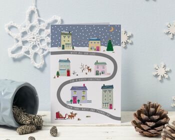 Carte de Noël personnalisée de la scène du village de la veille de Noël - à travers les kilomètres - de la famille 1