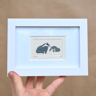 Badger and two young - collagraph print in a white frame