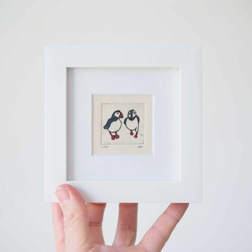 Two puffins - mini collagraph print in a white frame