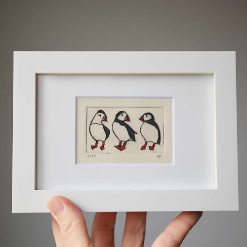 Three puffins - collagraph print in a white frame