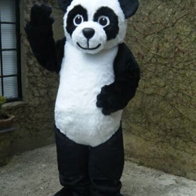 Giant black gorilla spotsound Mascot Costume with dark eyes and red tongue .