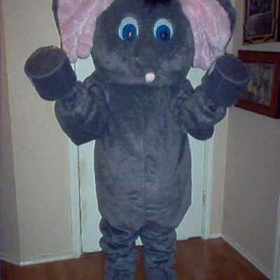 The Bull spotsound Mascot Costume in a grey suit with a black hooves and tail .