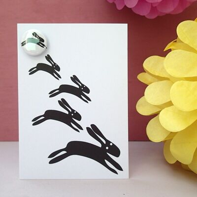 Leaping Black Rabbits - greeting card with badge