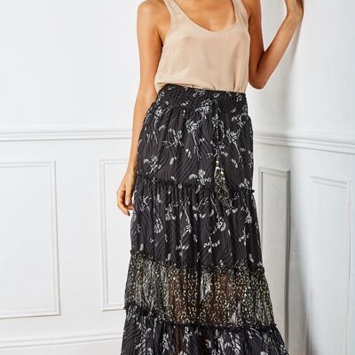 Black, vaporous and pleated skirt with white flower print, with cord adorned with bells