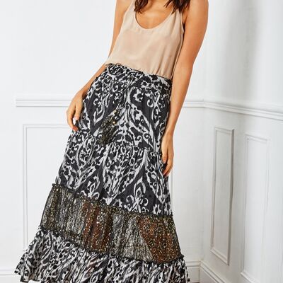 Black and white, vaporous and pleated printed skirt with bells-adorned cord