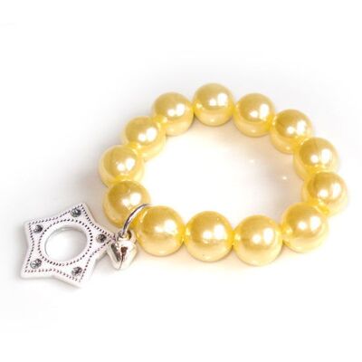 Pulsera infantil perla en color crema con estrella blanca