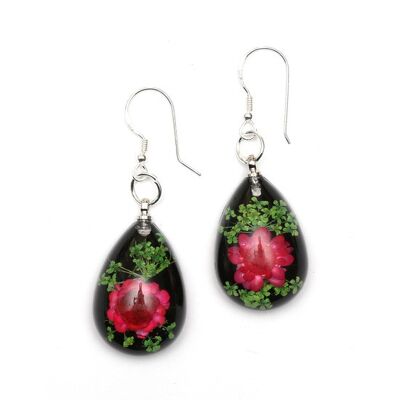 Rosafarbene gepresste Blume in schwarzen Tropfen-Ohrringen aus Harz