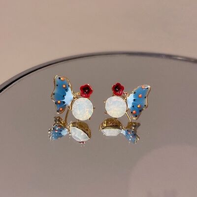 blue-butterfly-play-with-red-flower-on-stone-ear-stud
