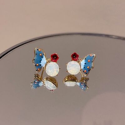 blue-butterfly-play-with-red-flower-on-stone-ear-stud