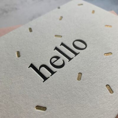 Minimalist 'Hello' card with gold shimmer confetti