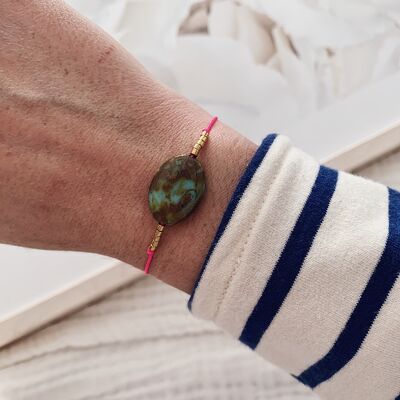 Neon pink cord bracelet + spotted green bead