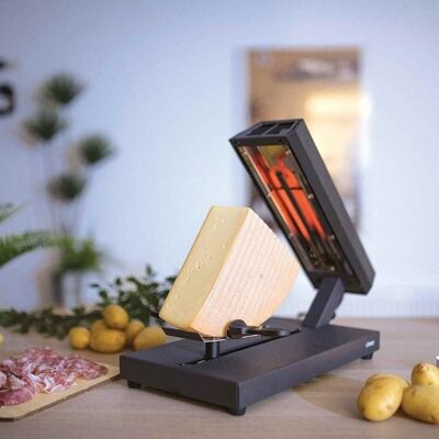 Traditional black raclette grill