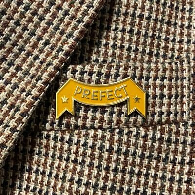 Spilla del prefetto Tassorosso di Harry Potter anni '20