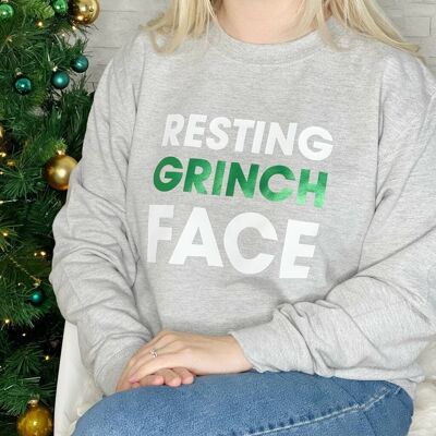 Sudadera navideña con cara de Grinch descansando