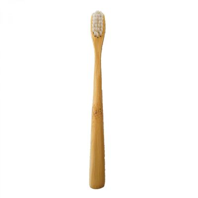 Cepillo de dientes de bambú natural para niños.