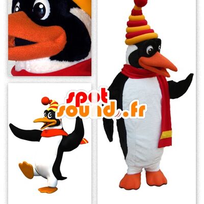 Costume de mascotte personnalisable de joli pingouin blanc et noir habillé en tenue d'hiver.