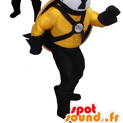 Costume de mascotte personnalisable de chien noir, jaune et blanc avec un bouclier.