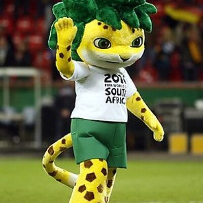 Costume de mascotte personnalisable de tigre jaune, tacheté avec des cheveux verts.