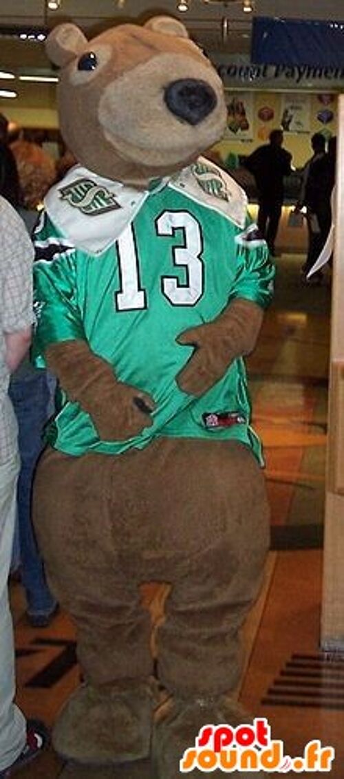 Costume de mascotte personnalisable d'ours brun avec un maillot de sport vert et blanc.