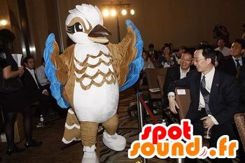 Costume de mascotte personnalisable d'oiseau marron, blanc et bleu.