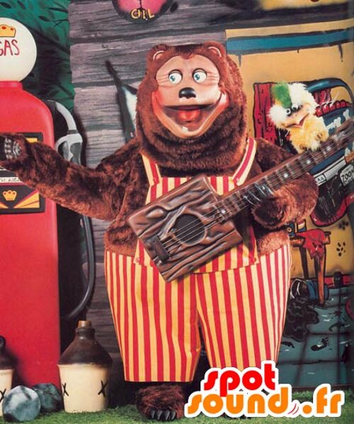 Costume de mascotte personnalisable de gros ours marron avec une salopette rouge et jaune.