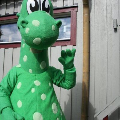 Costume de mascotte personnalisable de dragon, de dinosaure vert à pois blancs.