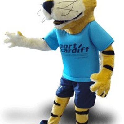 Costume de mascotte personnalisable de tigre jaune, noir et blanc, avec une tenue bleue.