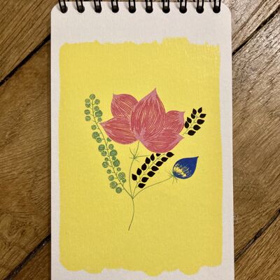 Sunny yellow notepad with spirals