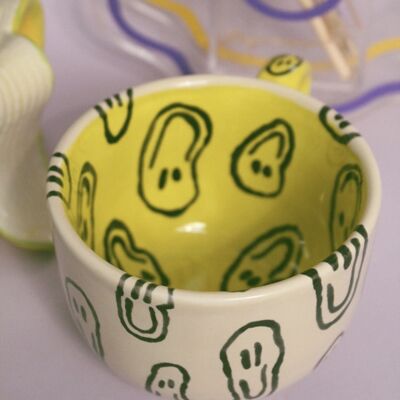 Taza de cerámica con sonrisa derretida