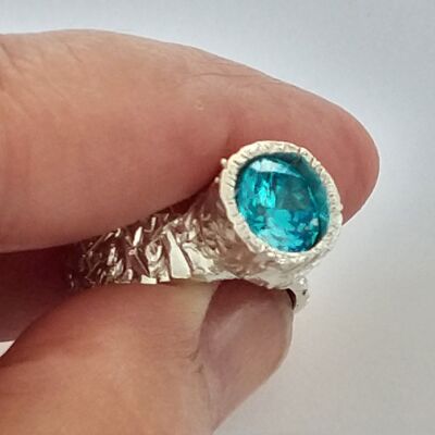 Silver ring with turquoise blue zirconia