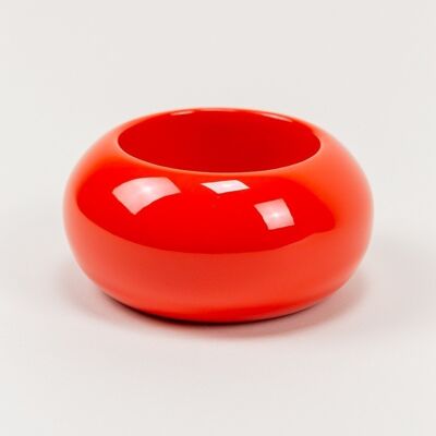 Very large round bracelet in orange lacquered wood