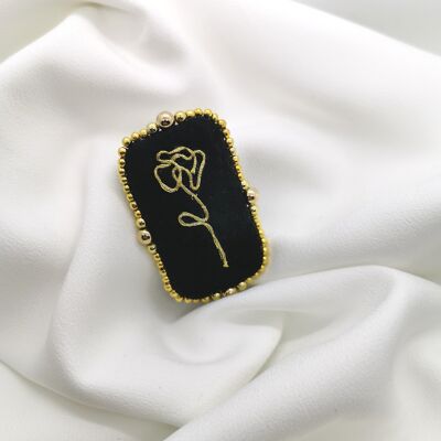 Black velvet brooch embroidered with a rose in gold thread