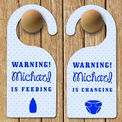 Personalised Baby Warning Door Hanger in Blue (PER201-BLU) (TreatRepublic983)