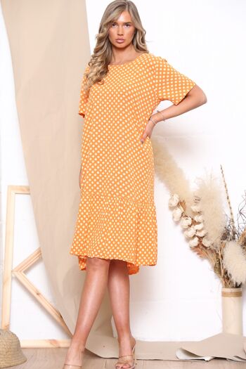 Robe orange à pois à manches courtes 1