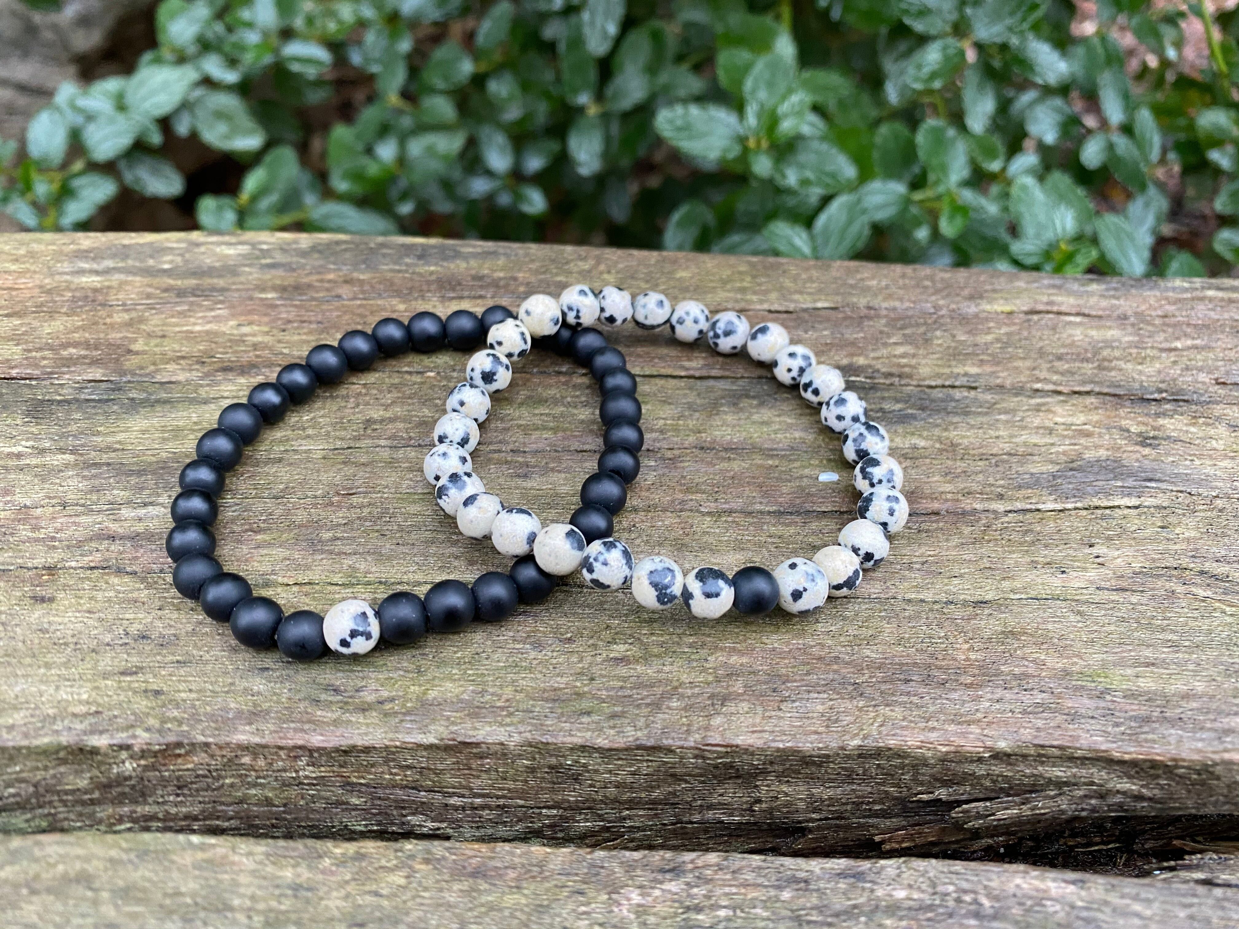 Elastic distance and couple bracelets in black Agate and Dalmatian Jasper
