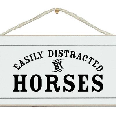 Se distrae fácilmente con los caballos Signos de animales