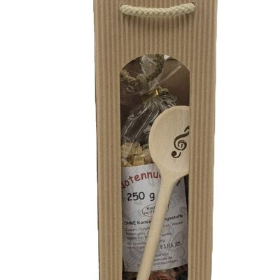 Gift set with sheet music pasta, treble clef wooden spoon and pasta sauce in carrying case