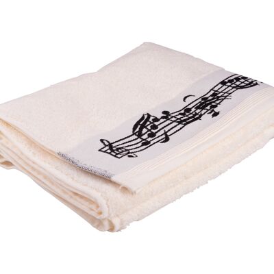 Cream-colored bath towel with border of notes and woven treble clef
