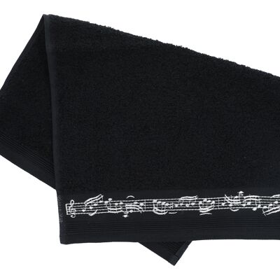 black guest towel with border of notes