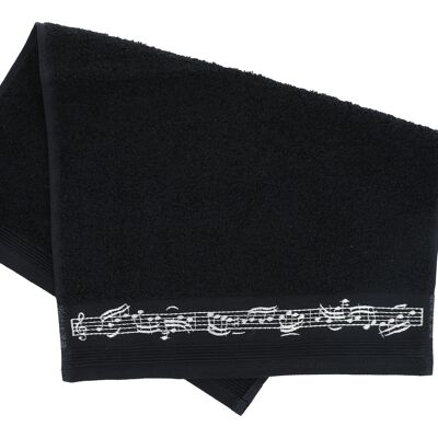 black guest towel with border of notes