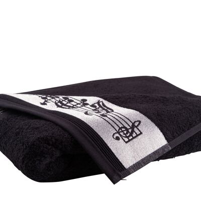black bath towel with border of notes and woven treble clef