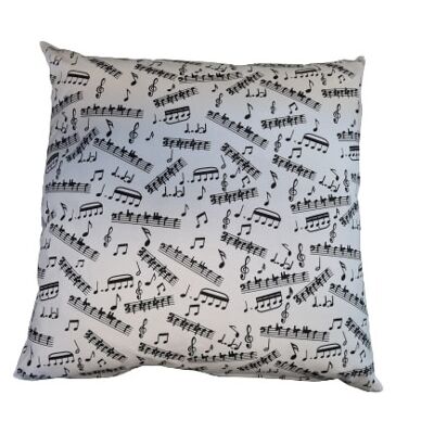stuffed pillow with musical notes and clefs