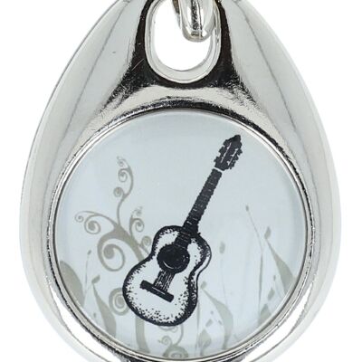 Key ring with a musical motif and a shopping chip
