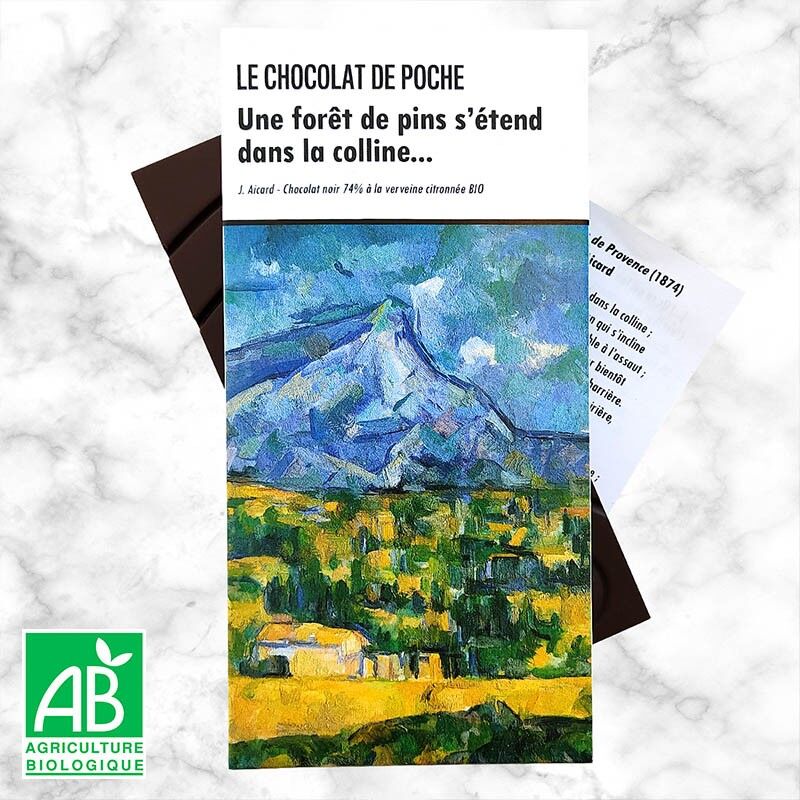 Barra de chocolate negro 74% con verbena de limón BIO - Un bosque de pinos se extiende a lo largo de la colina...