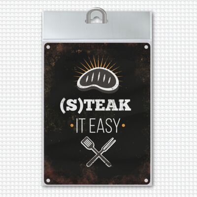 Metal sign with BBQ motif and saying: Steak it easy