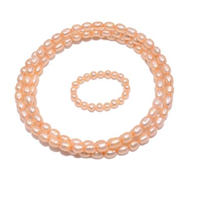 Wrap bracelet with ring made of freshwater cultured pearls in apricot