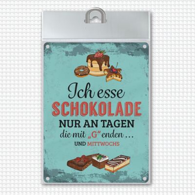 Metal sign with chocolate motif and saying: I only eat chocolate on days