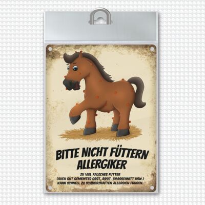 Metal sign with horse motif and saying: Please do not feed - allergy sufferers