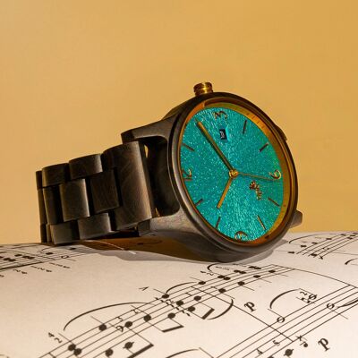 Opis UR-U1: The classic unisex retro wooden wristwatch made of black sandalwood with a unique, embossed turquoise dial with golden metal components