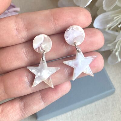Pearl effect resin star drop earrings.